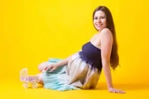 Petite and Pregnant? Here’s What Might Be in Store for You! pregnant woman on floor